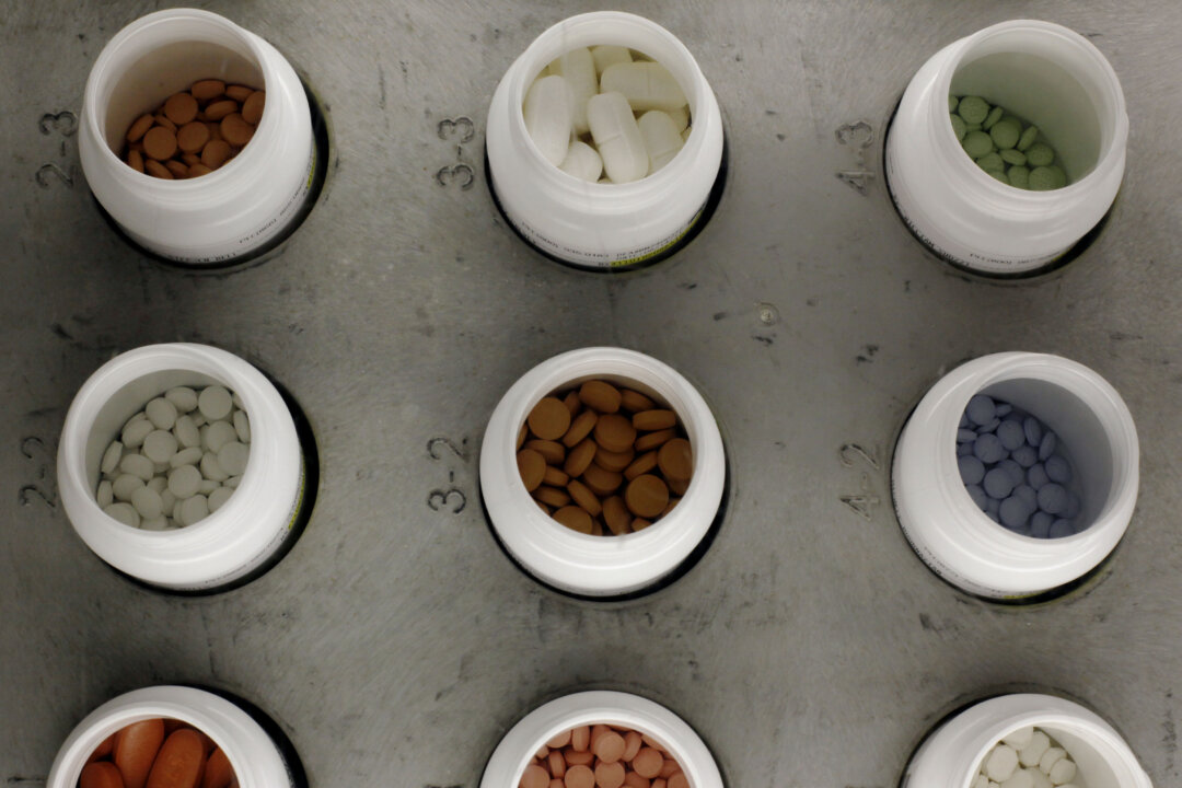 Various prescription drugs on the automated pharmacy assembly line at Medco Health Solutions, in Willingboro, N.J., on June 14, 2011. Some low-cost generic drugs that have helped restrain health care costs for decades are seeing unexpected price spikes of up to 8,000 percent, prompting a backlash from patients, pharmacists and now Washington lawmakers. (AP Photo/Matt Rourke)
