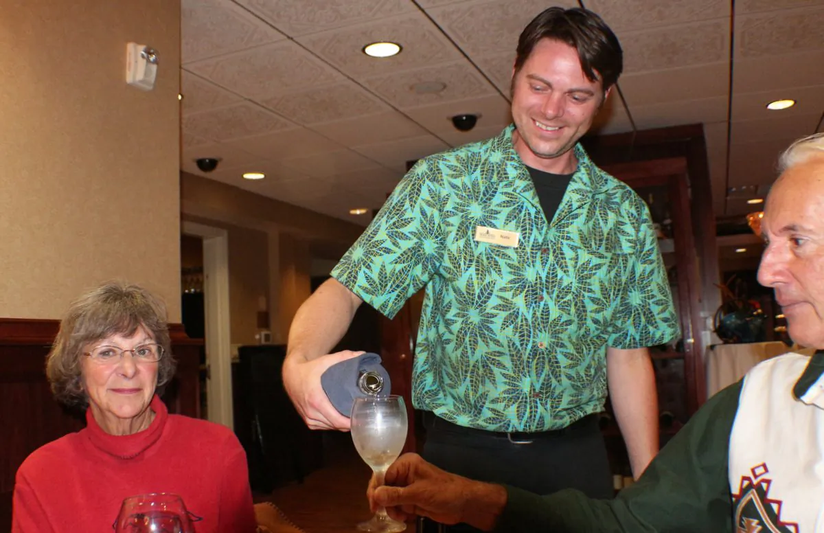 Gem server Nate Rickman pouring wine from a good selection of house and bottled offerings. (Myriam Moran copyright 2014)