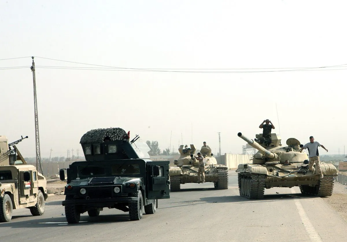 Iraqi military are seen along a main highway in Iraq's Anbar province, west of the provincial capital Ramadi, on Aug. 18, 2014, as Iraqi security forces backed by Sunni Arab tribal militia made gains against the jihadists in Iraq's Anbar province, Iraqi police said. (Azhar Shallal/AFP/Getty Images)