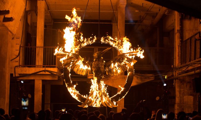 The burnig symbol of the movie is pictured during the 'The Hunger Games: Mockingjay Part 1' preview event at Kraftwerk Mitte on Nov. 11, 2014, in Berlin, Germany. (Christian Marquardt/Getty Images)