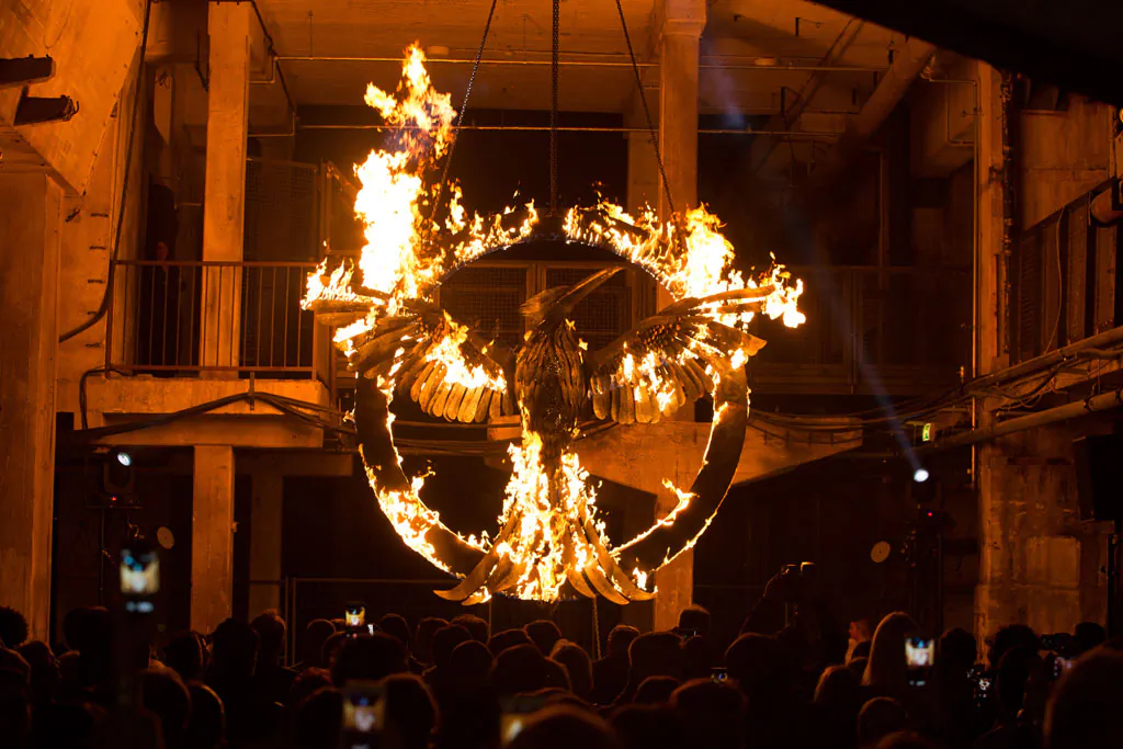 The burning symbol of the movie is pictured during the “The Hunger Games: Mockingjay Part 1” preview event at Kraftwerk Mitte, in Berlin, Germany, on Nov. 11, 2014. (Christian Marquardt/Getty Images)