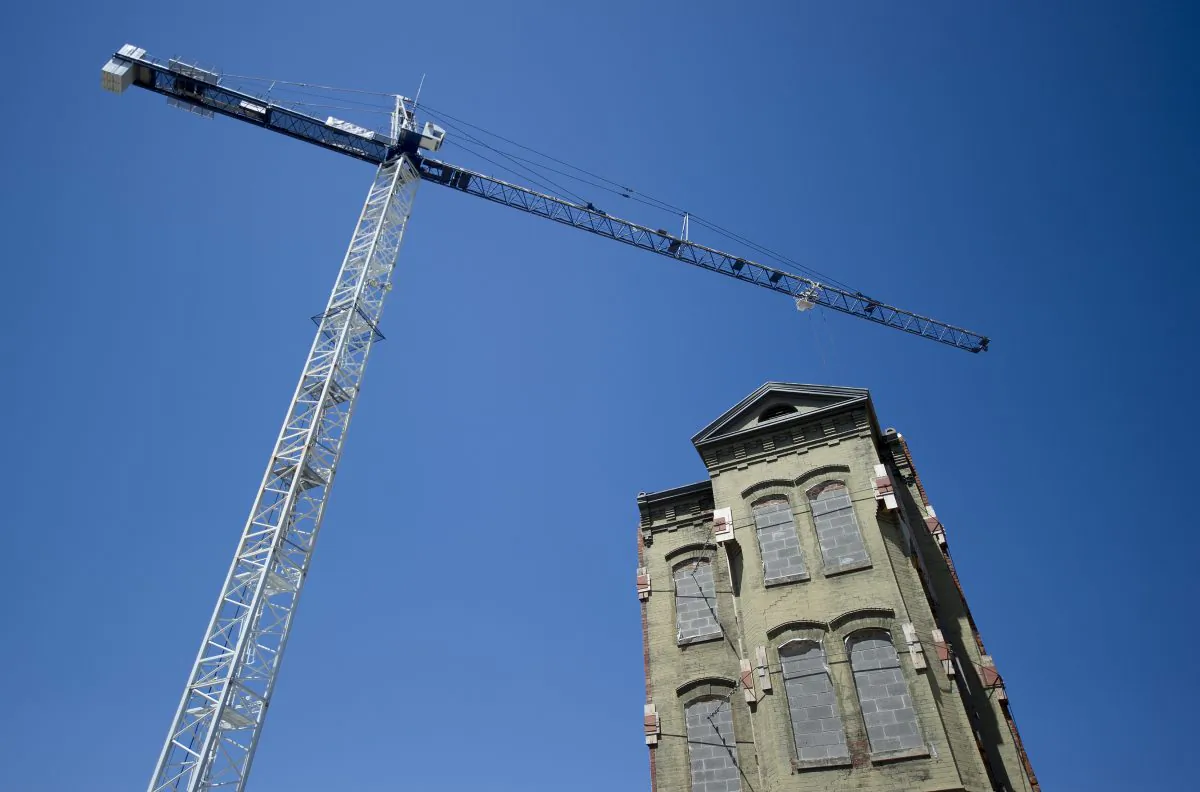 A giant crane stands near a historic building that is being incorporated into new construction in Washington, DC, on May 1, 2013. Affordable housing in the Washington, D.C. metropolitan area is turning into a real issue, according to an October Urban Institute report. (JIM WATSON/AFP/Getty Images)