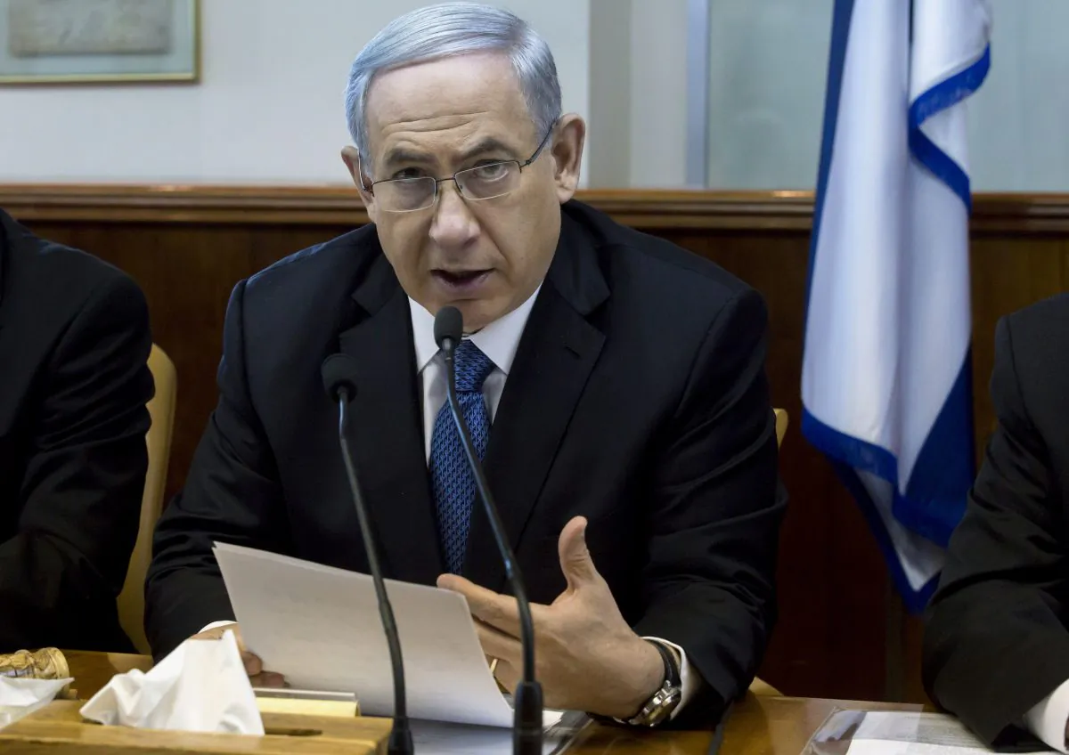 Israeli Prime Minister Benjamin Netanyahu speaks during in his Cabinet meeting in his office in Jerusalem on Sunday, Nov. 23, 2014. At the start of the meeting, Netanyahu called for a bill that would revoke residency rights for Palestinians involved in attacks against Israelis. (AP Photo/Jim Hollander)
