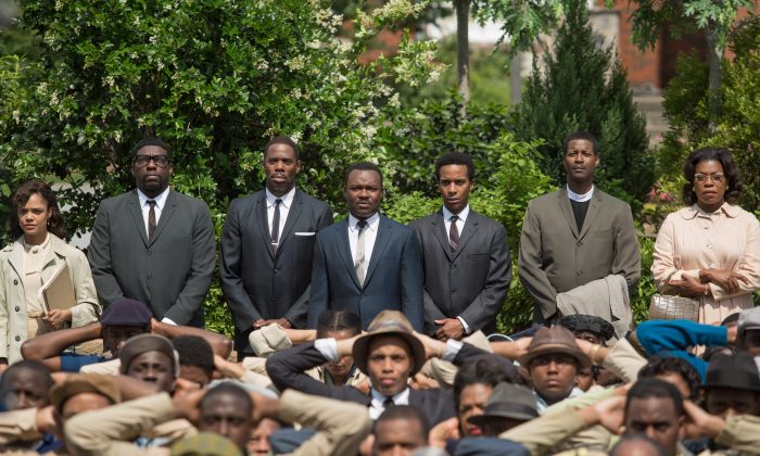This image released by Paramount Pictures shows, standing from left, Tessa Thompson, Omar Dorsey, Colman Domingo, David Oyelowo as Martin Luther King, Jr., André Holland, Corey Reynolds and Lorraine Toussaint in a scene from "Selma." The film was nominated for five Spirit Awards on Tuesday, Nov. 25, 2014. Winners will be revealed at the annual awards ceremony on Feb. 21. 2015. The ceremony will air live from Santa Monica, Calif. on IFC. (AP Photo/Paramount Pictures, Atsushi Nishijima)