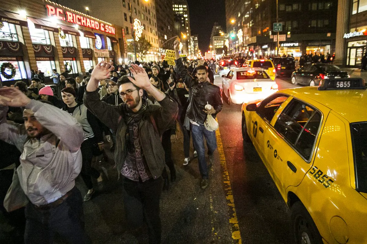 New Yorkers protest in Manhattan on Nov. 25, 2014, the day after a grand jury decision in Ferguson, Mo., not to indict a police officer who fatally shot unarmed teenager Michael Brown. (Samira Bouaou/Epoch Times)