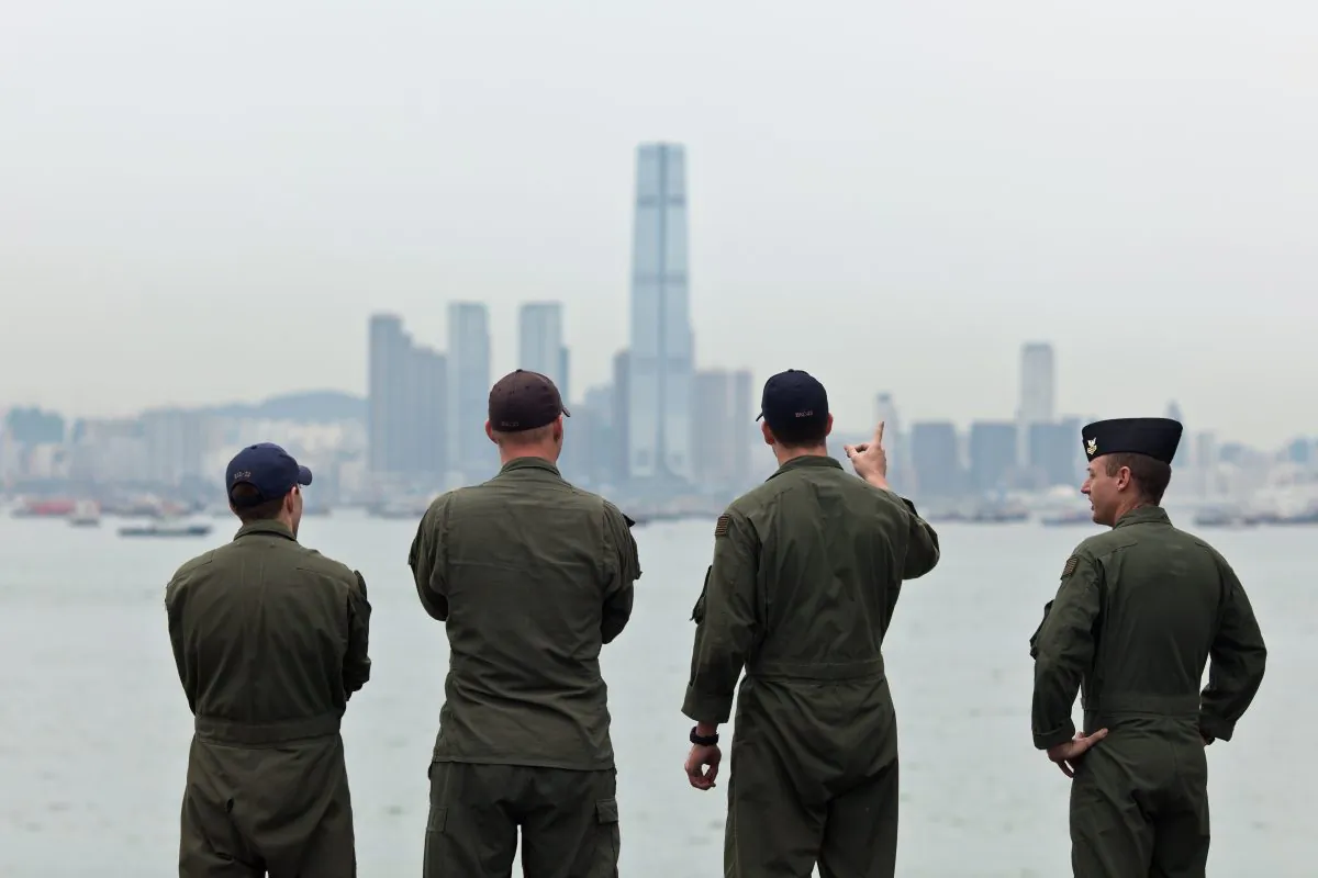Navy personnel on board the USS Makin Island look towards the ICC building (C) in Hong Kong on Aug. 20, 2014. Michael Pillsbury, a top adviser to the Pentagon, says the US needs to rethink its analysis on China. (Anthony Wallace/AFP/Getty Images)