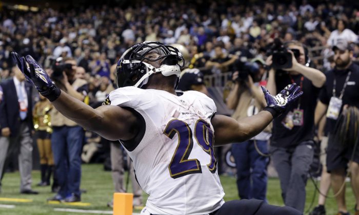 Baltimore Ravens running back Justin Forsett celebrates his touchdown carry in the second half of an NFL football game against the New Orleans Saints in New Orleans, Monday, Nov. 24, 2014. The Ravens won 34-27. (AP Photo/Jonathan Bachman)