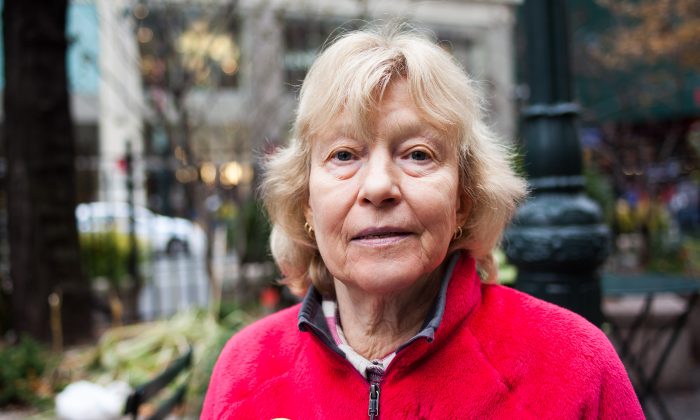 Eva-Lee Baird, retired art teacher currently with Grannies Peace Brigade, in Midtown Manhattan, NY, on Nov. 25, 2014. (Petr Svab/Epoch Times)