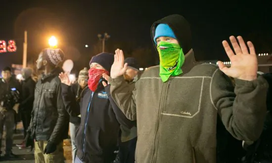 Ferguson Police Respond to Protesters Smashing City Hall Windows and Setting Fire to Cop Car (Video)