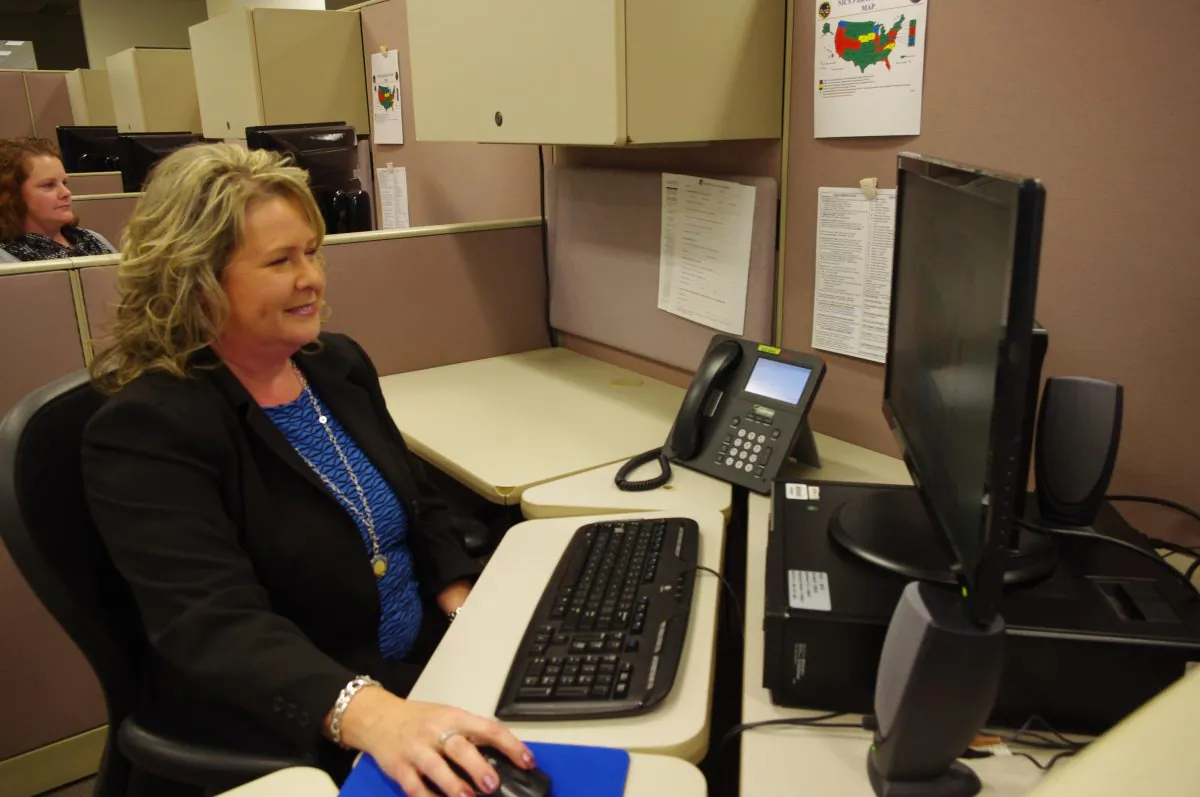 Researcher Valerie Sargo simulates a check done for the National Instant Criminal Background Check System or NICS, at the FBI’s criminal justice center in Bridgeport, W.Va., on Nov. 18, 2014. NICS did about 58,000 checks on a typical day in 2013. That surged to 145,000 on Black Friday. (AP Photo/Matt Stroud)