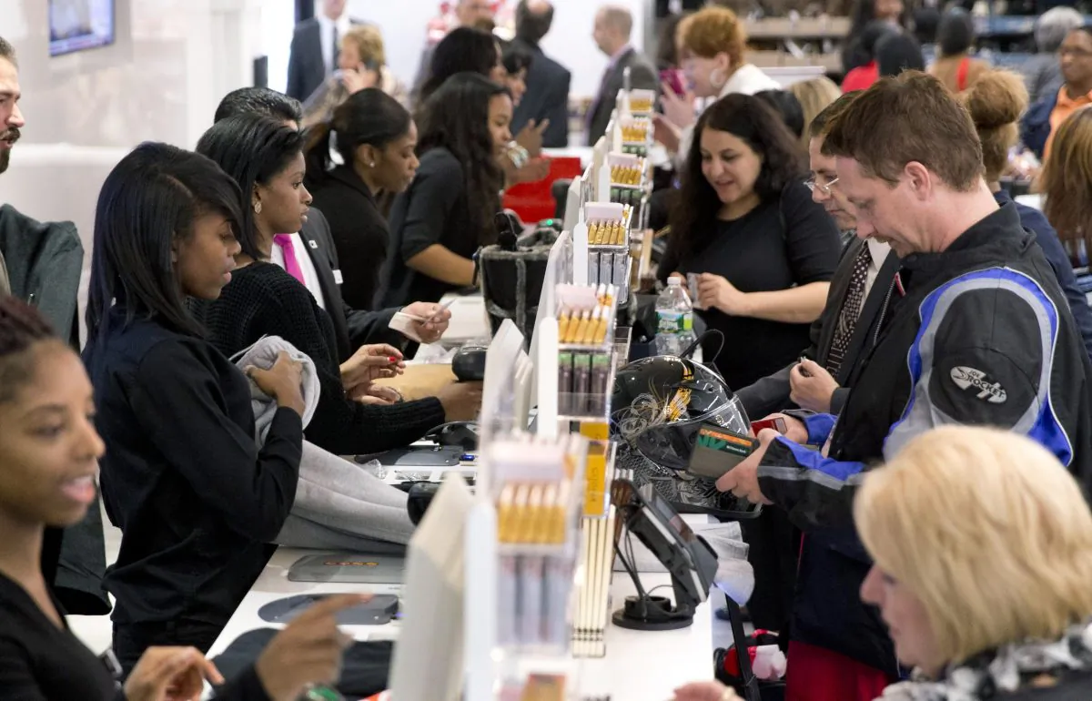 Customers shop at a Century 21 Department Store in Philadelphia on Oct. 28, 2014. The Commerce Department releases personal income and spending for October on Wednesday, Nov. 26, 2014. (AP Photo/Matt Rourke)