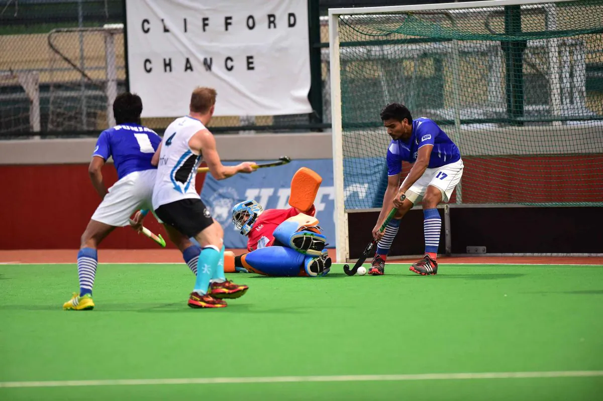 Punjab-A’s number 17, Gagandeep Singh saves off the line during their 3-2 win in the Hong Kong Hockey Association Premier Division match against HKFC-A at Sports Road on Sunday Nov. 23, 2014. (Bill Cox/Epoch Times)
