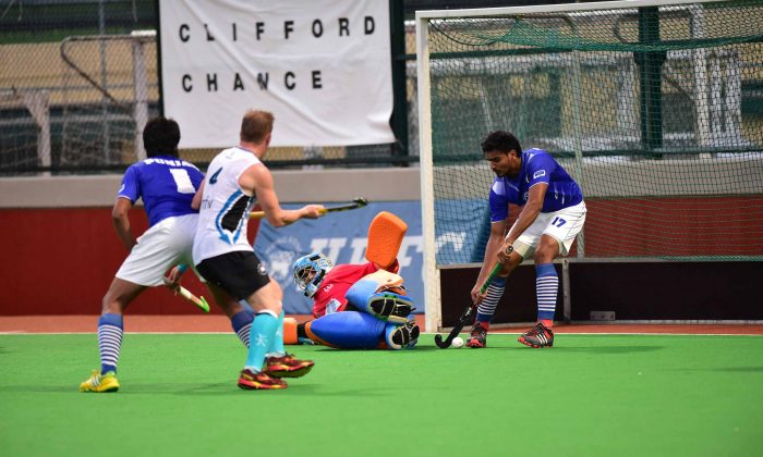 Punjab-A’s number 17, Gagandeep Singh saves off the line during their 3-2 win in the Hong Kong Hockey Association Premier Division match against HKFC-A at Sports Road on Sunday Nov. 23, 2014. (Bill Cox/Epoch Times)
