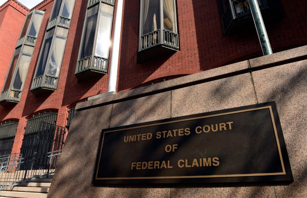 The exterior view of the US Court of Federal Claims in Washington on Oct. 21, 2014. The building houses a special vaccine court, which Congress established to speed help to vaccine-injured Americans. Instead, the system has heaped additional suffering on thousands of families, The Associated Press has found. Cases are supposed to be resolved within 240 days, with options for another 150 days of extensions. (AP Photo/Susan Walsh)