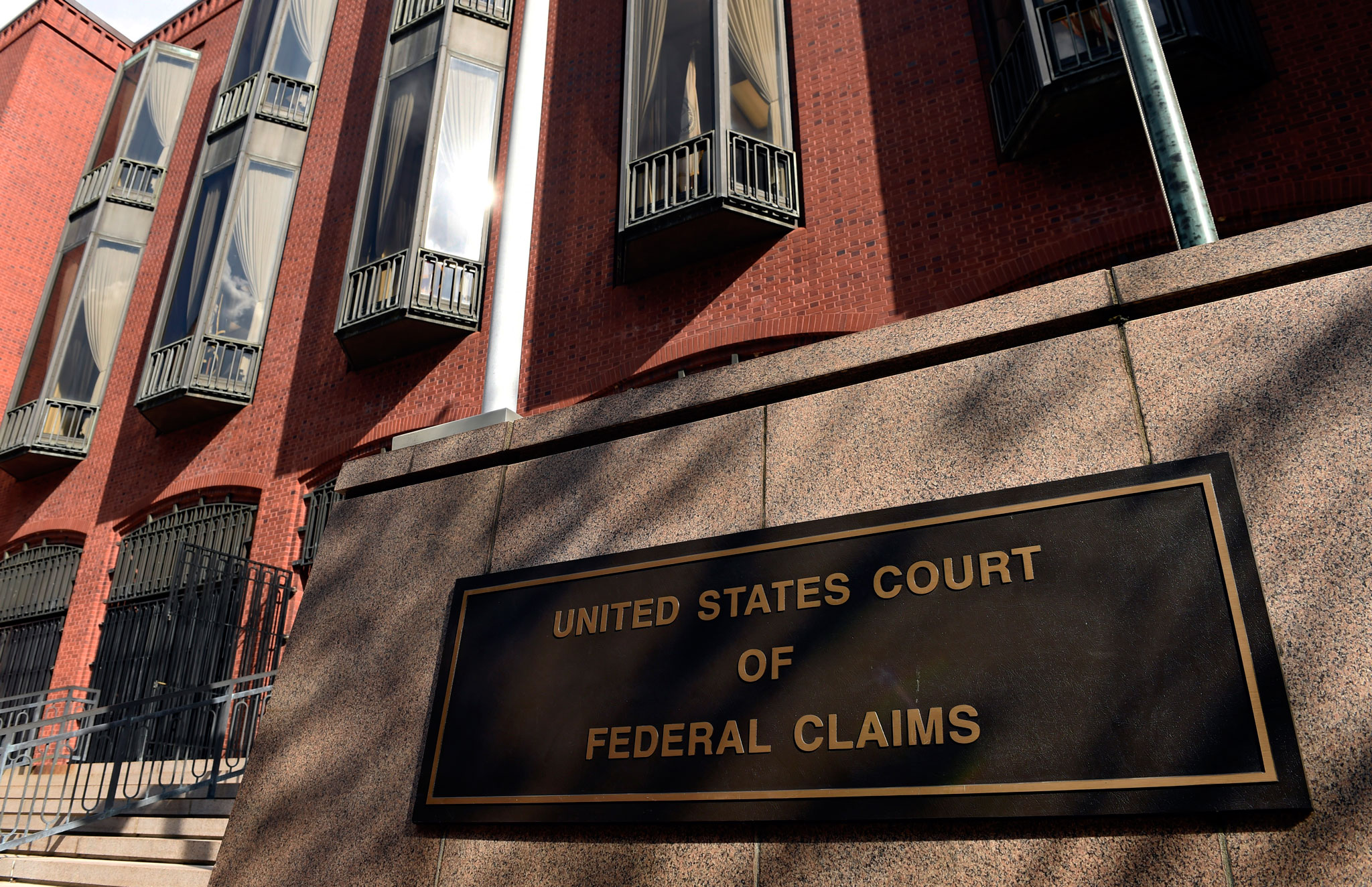 The exterior view of the US Court of Federal Claims in Washington on Oct. 21, 2014. The building houses a special vaccine court, which Congress established to speed help to vaccine-injured Americans. Instead, the system has heaped additional suffering on thousands of families, The Associated Press has found. Cases are supposed to be resolved within 240 days, with options for another 150 days of extensions. (AP Photo/Susan Walsh)