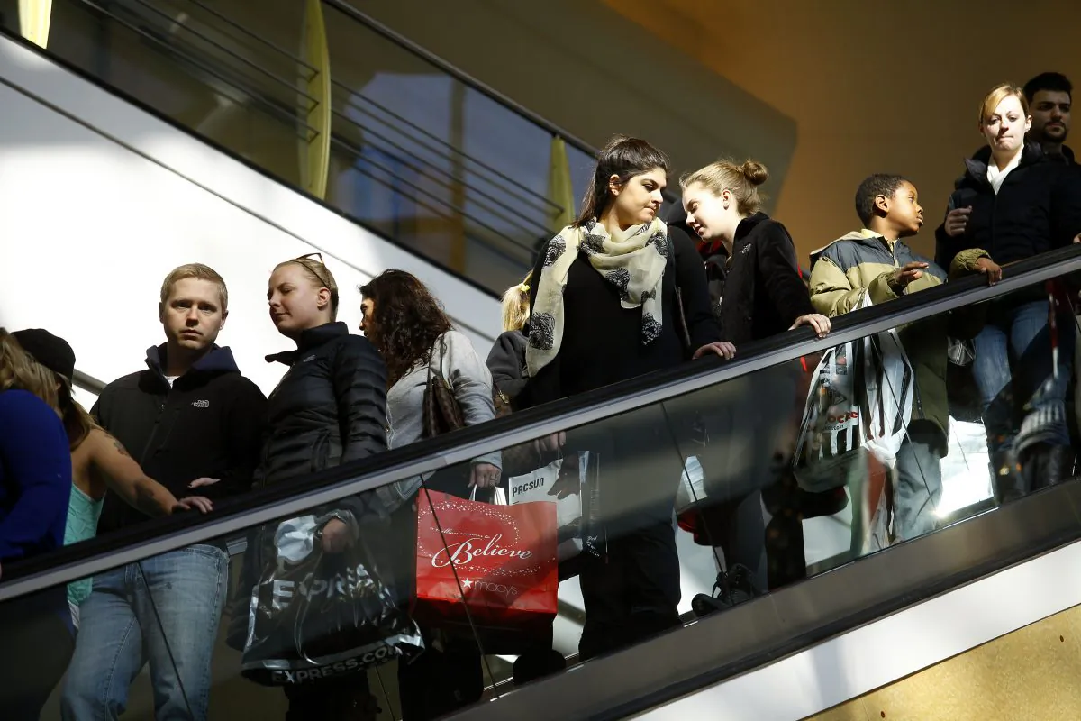 Shoppers ride an escalator as they shop for Black Friday deals at Somerset Collection shopping mall on Nov. 29, 2013, in Troy, Michigan. (Joshua Lott/Getty Images)
