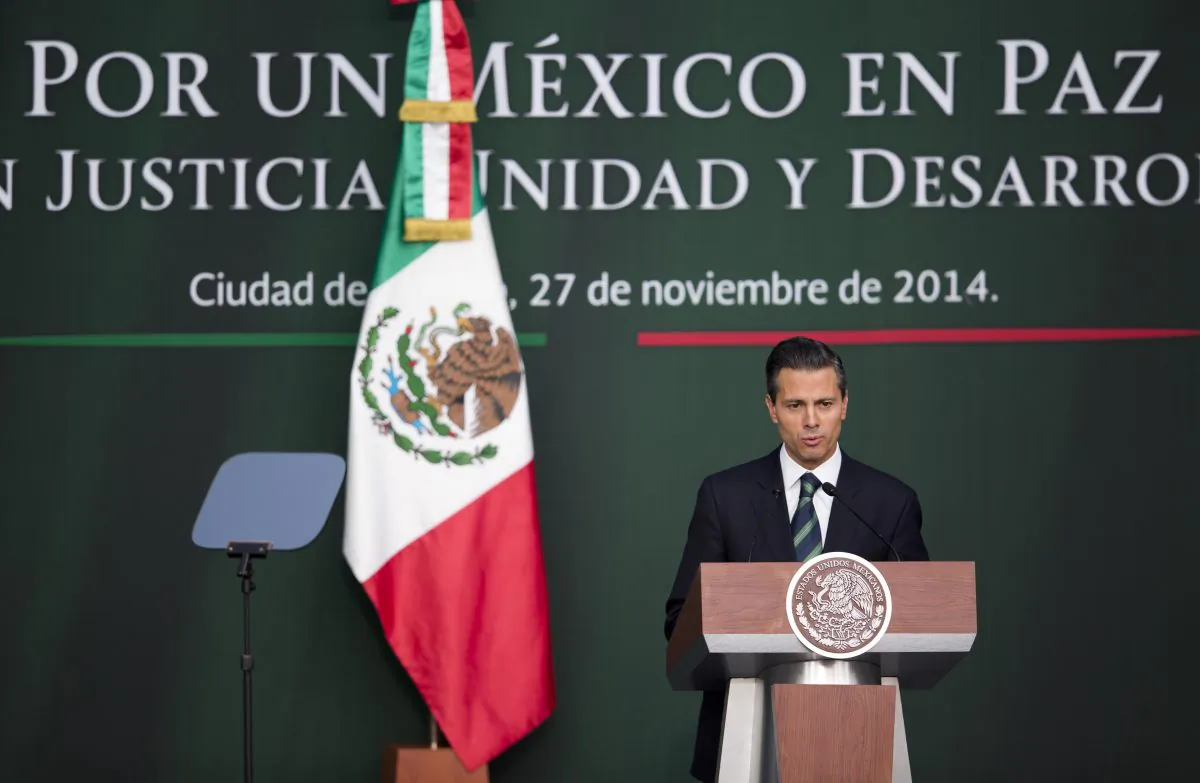 Mexico's President Enrique Pena Nieto speaks during a ceremony at the National Palace in Mexico City, Thursday, Nov. 27, 2014. Mexico's president announced a new anti-crime plan that includes proposals for a nationwide ID, giving Congress the power to dissolve corrupt municipal government and fold their often-corrupt local police forces under the control of the countrys 31 state governments. The plan would focus first on four of Mexicos most troubled states, Guerrero, Michoacan, Jalisco and Tamaulipas. (AP Photo/Eduardo Verdugo)
