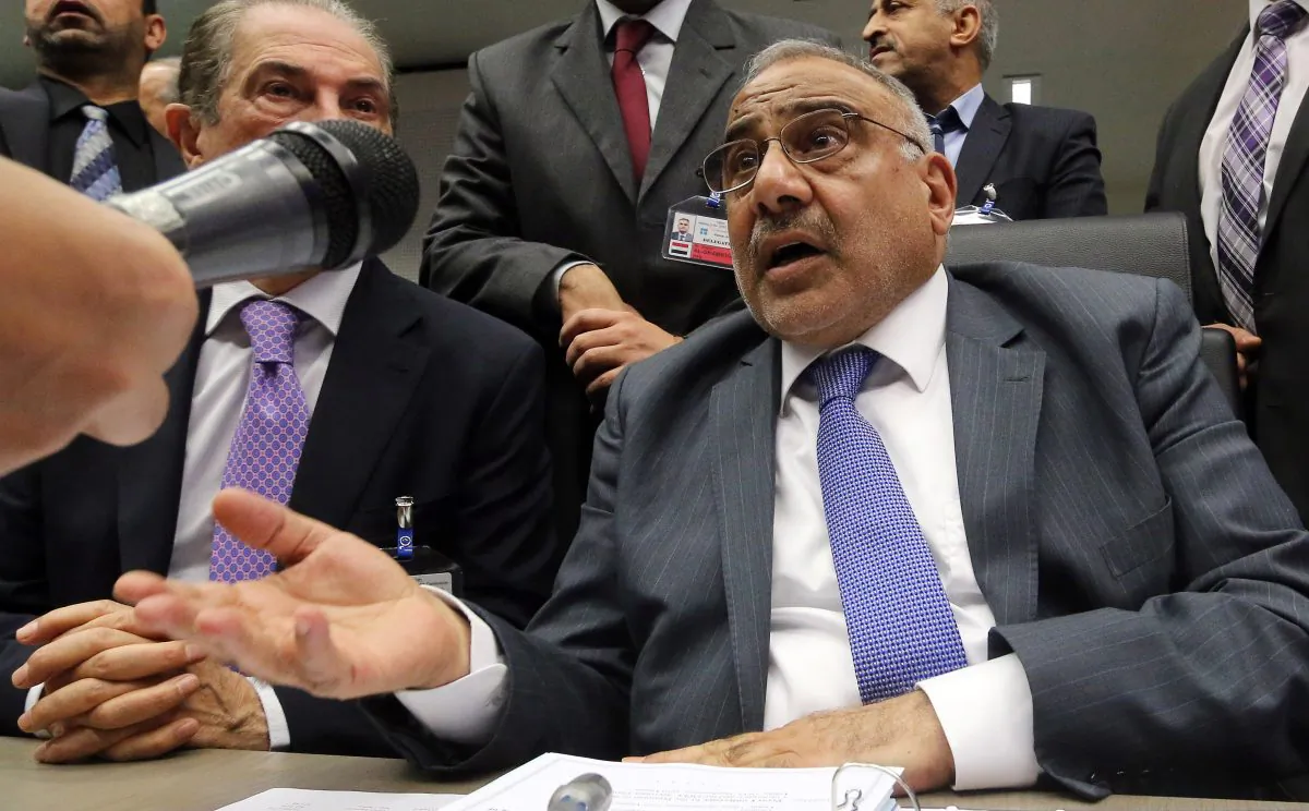Iraq's Minister of Oil Adil Abd Al-Mahdi speaks to journalists prior to the start of a meeting of the Organization of the Petroleum Exporting Countries, OPEC, at their headquarters in Vienna, Austria, Thursday, Nov. 27, 2014. Expectations that the group would not cut output to support the market saw the global price of oil slump another US dollar 1.89 on Thursday to US dollar 75.86 a barrel, extending its losses since June, when it was as high as US dollar 115. (AP Photo/Ronald Zak)