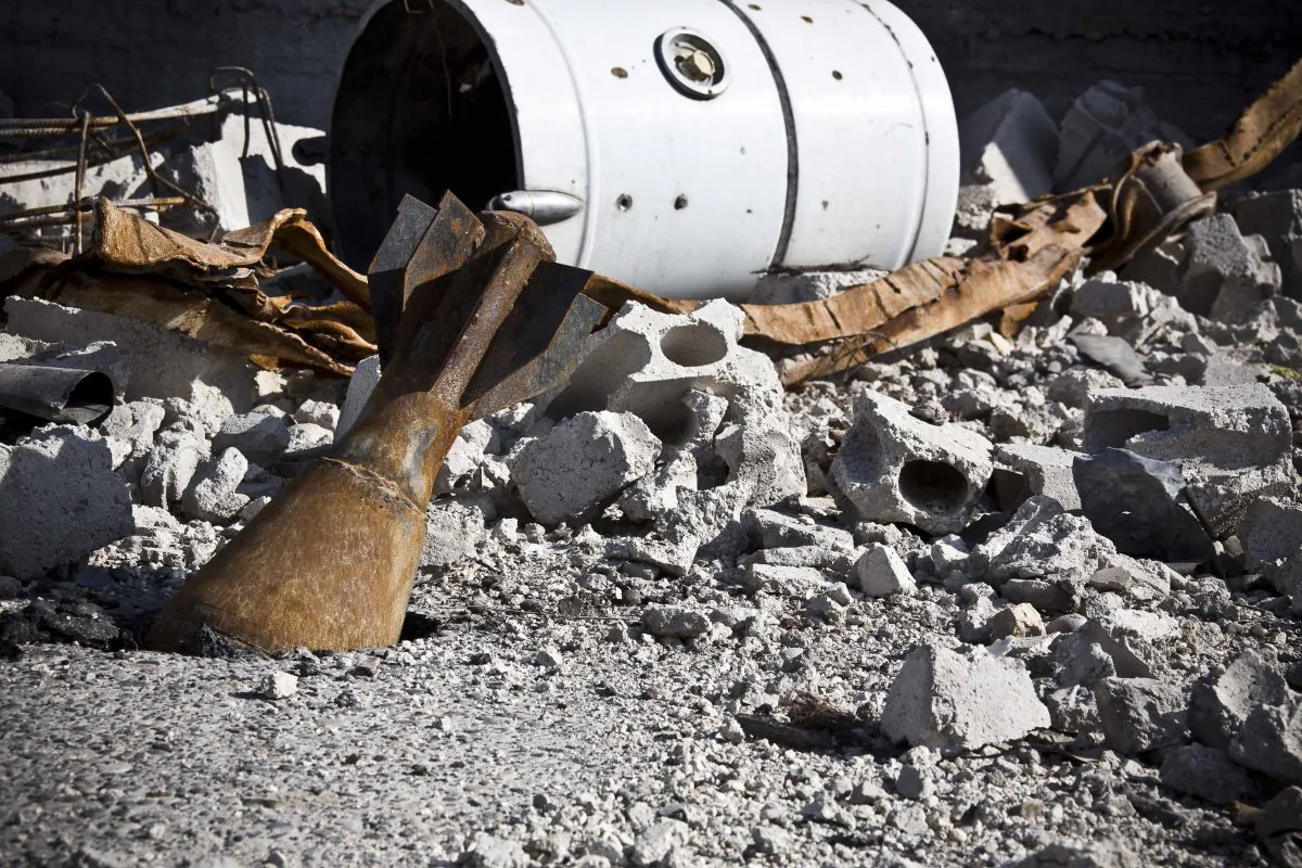 In this Wednesday, Nov. 19, 2014 photo, a mortar remains in the street in Kobani, Syria. Here, Kurdish fighters backed by small numbers of Iraqi peshmerga forces and Syrian rebels, are battling what they see as an existential battle against the militants who swept into their town in mid-September as part of a summer blitz that saw the group seize large chunks of territory in Syria and neighboring Iraq. (AP Photo/Jake Simkin)