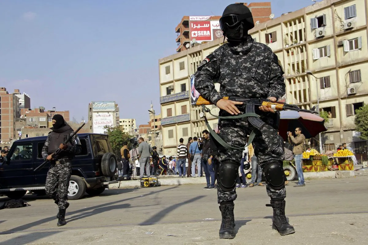 Masked Egyptian security forces deploy in the Cairo suburb of Matareya on the day that Islamists called for nationwide demonstrations Friday, Nov. 28, 2014. (AP Photo/Ahmed Abdel Fattah)