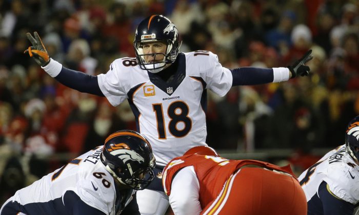 Denver Broncos quarterback Peyton Manning (18) calls a play in the first half of an NFL football game against the Kansas City Chiefs in Kansas City, Mo., Sunday, Nov. 30, 2014. (AP Photo/Charlie Riedel)