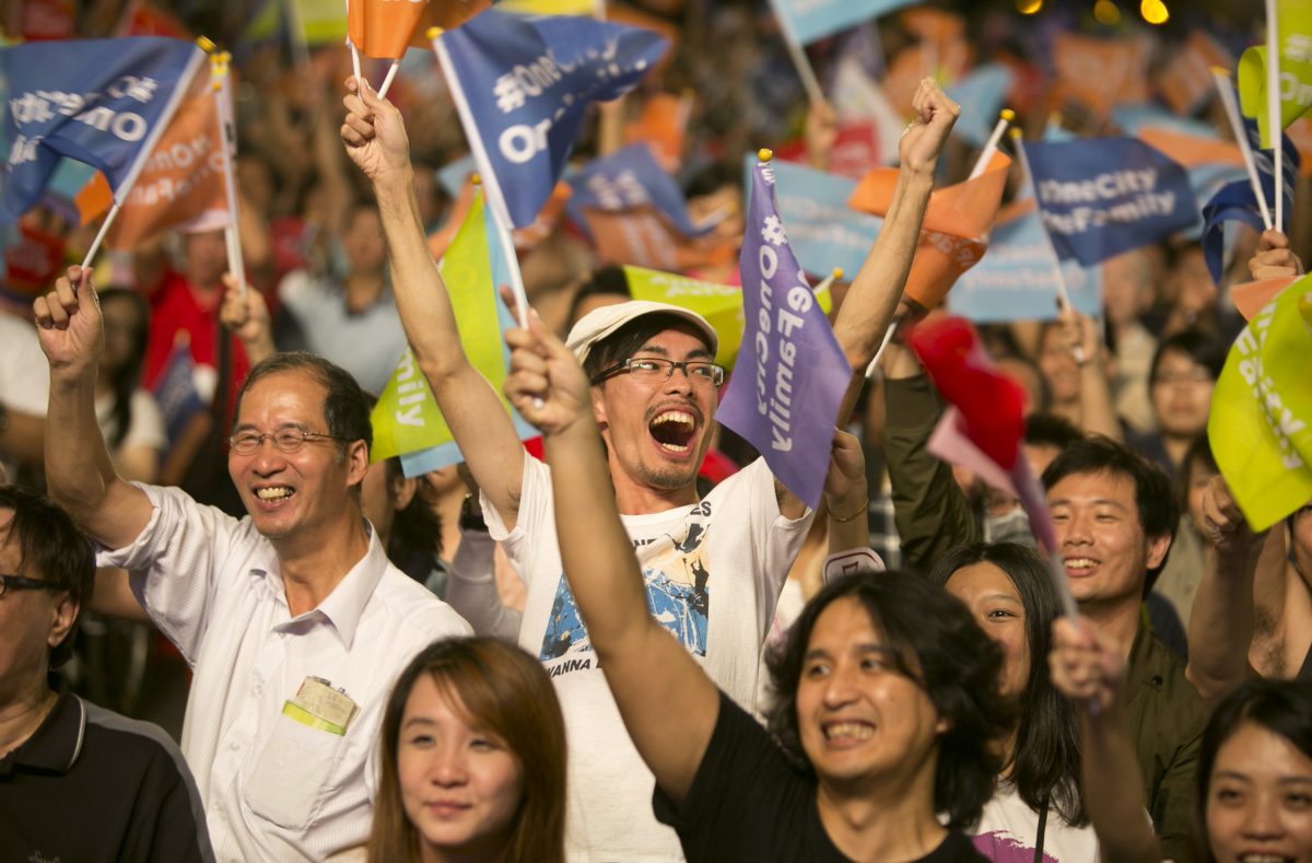 Supporters of Ko Wen-je celebrate after Ko won the Taipei mayoral elections on Nov. 29, 2014 in Taipei, Taiwan. Millions of voters went to the polls for the island's largest ever local elections, as Independent Taipei mayor-elect Ko Wen-je won. (Ashley Pon/Getty Images)