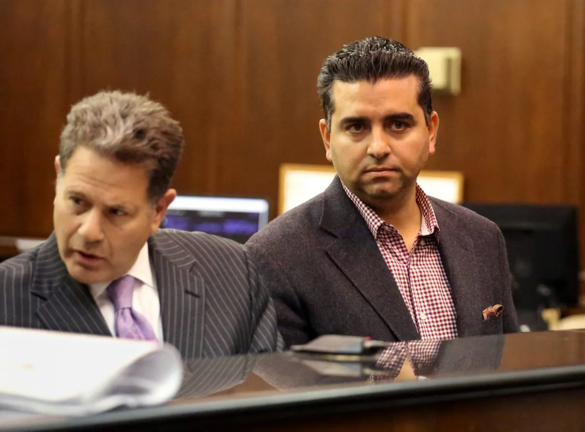 “Cake Boss” star Buddy Valastro (R) appears at his arraignment on drunk driving charges in Manhattan Criminal Court in New York on Nov. 13, 2014. Valastro on Monday, Dec. 1, 2014, pleaded guilty to driving while ability impaired. His driver’s license will be suspended for three months. (AP Photo/New York Daily News, Jefferson Siegel)