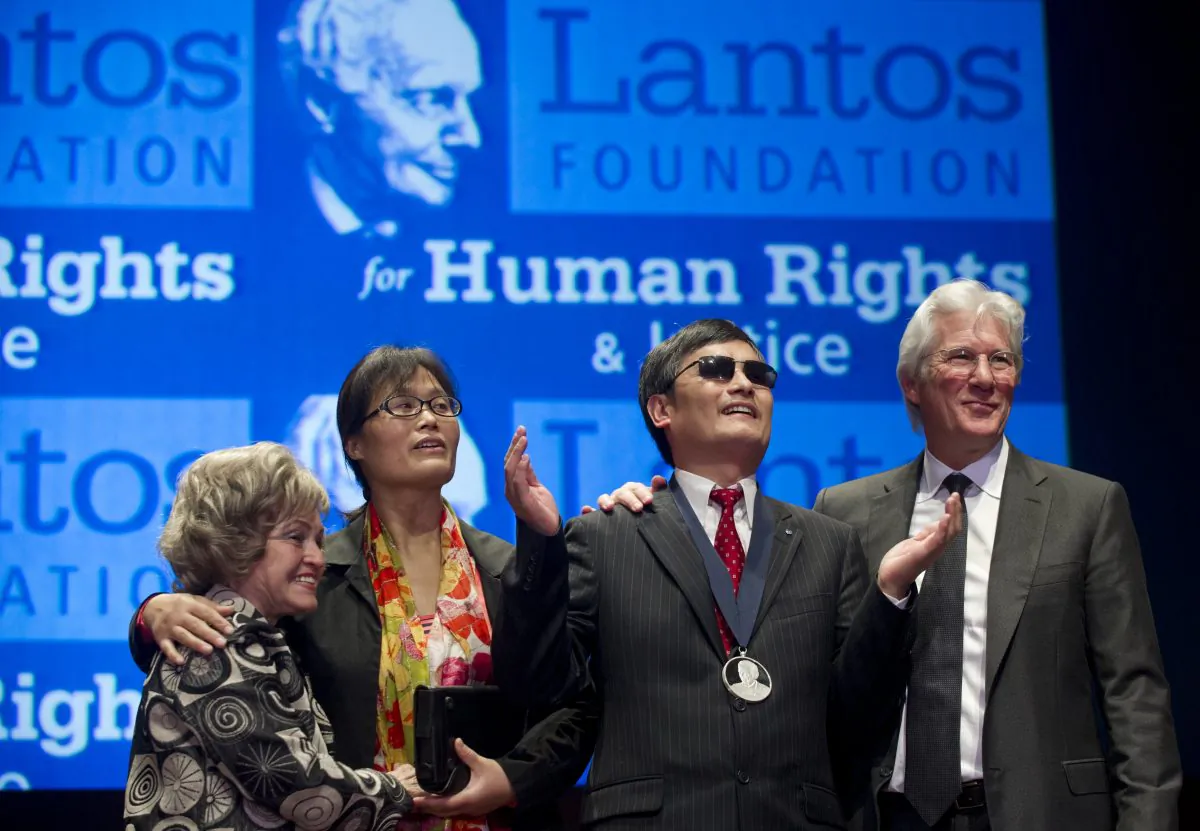 Richard Gere presents Chinese human rights activist Chen Guangcheng with the Tom Lantos Human Rights Prize, U.S. Capitol, Washington, D.C., on Jan. 29, 2013. (Saul Loeb/AFP/Getty Images)
