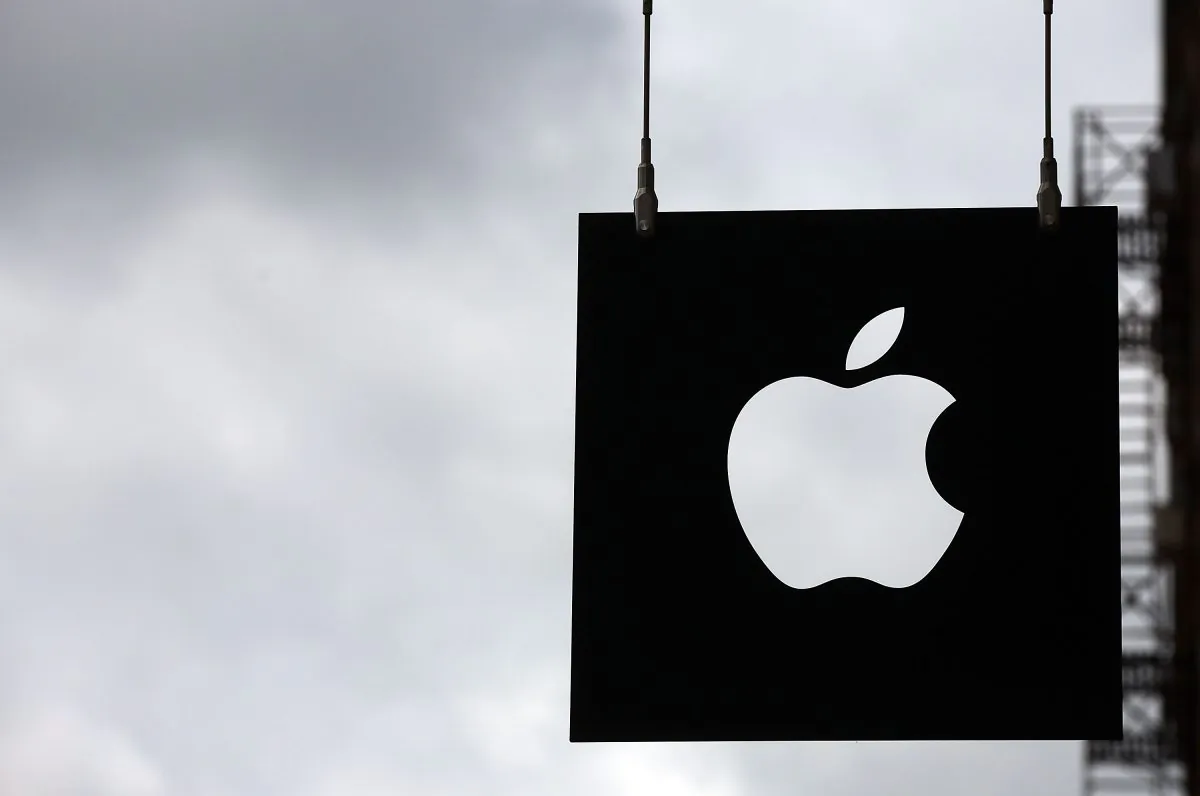 The Apple logo hangs in front of an Apple store on July 23, 2013, in New York City.  (Spencer Platt/Getty Images)
