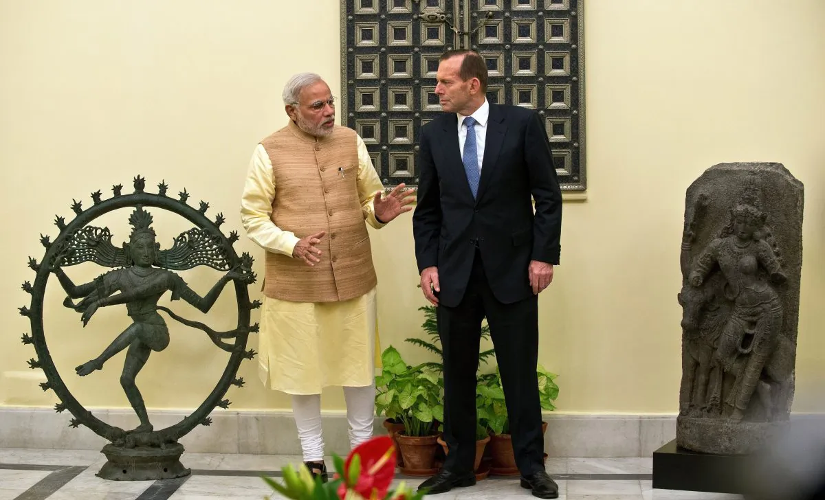 In September, Tony Abbott returned two antique statues to India in the presence of his Indian counterpart Narendra Modi. (Prakash Singh/AFP/Getty Images)