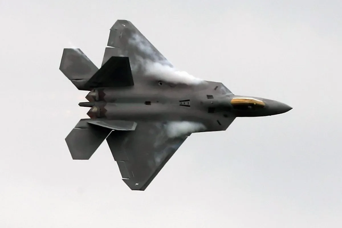 A U.S. F-22 Raptor fighter flies during an aerial display at Farnborough Airshow, Hampshire, on July 14, 2008. (Carl de Souza/AFP/Getty Images)