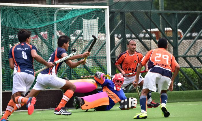 SSSC-A Goalie, Gurdeep Singh makes a fine save during the final of the Guru Nanak Cup Final against Khalsa-A at Happy Valley on Sunday Nov. 30, 2014. SSSC-A won an exciting final with a golden goal in extra time. (Bill Cox/Epoch Times)