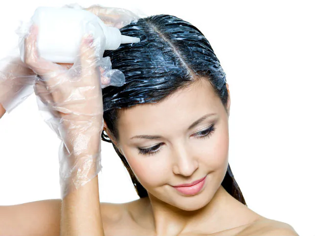 If you feel you must use commercial hair dyes, it's recommended to apply a petroleum-based ointment to the scalp before chemical hair dyes are applied. (Shutterstock)