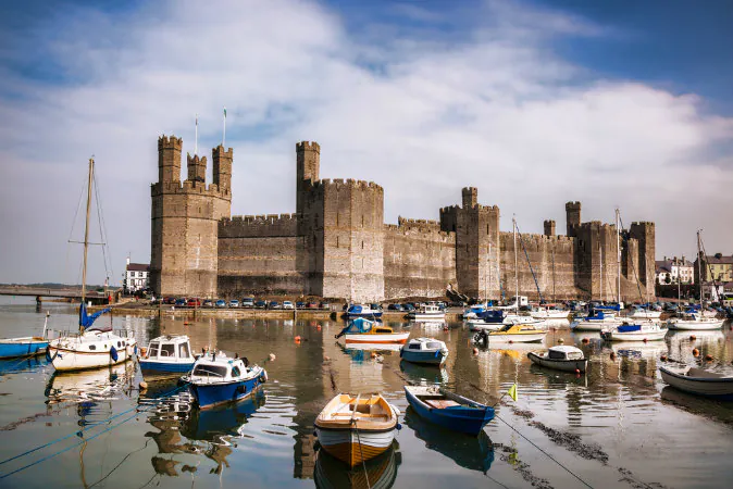 Caernarfon Castle in Wales via Shutterstock*