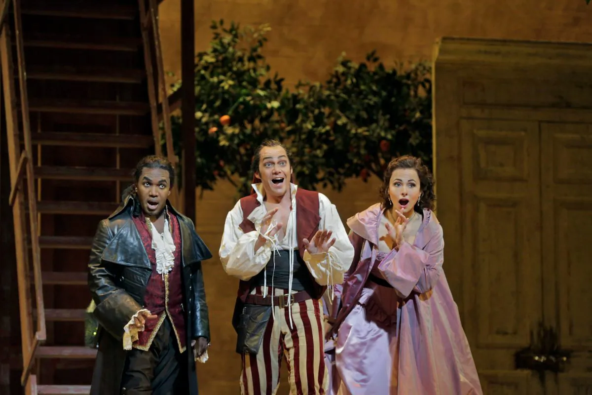 The stars of the Metropolitan Opera’s production “The Barber of Seville,” (L–R) Lawrence Brownlee as Count Almaviva, Christopher Maltman as Figaro, and Isabel Leonard as Rosina. (Ken Howard/Metropolitan Opera)