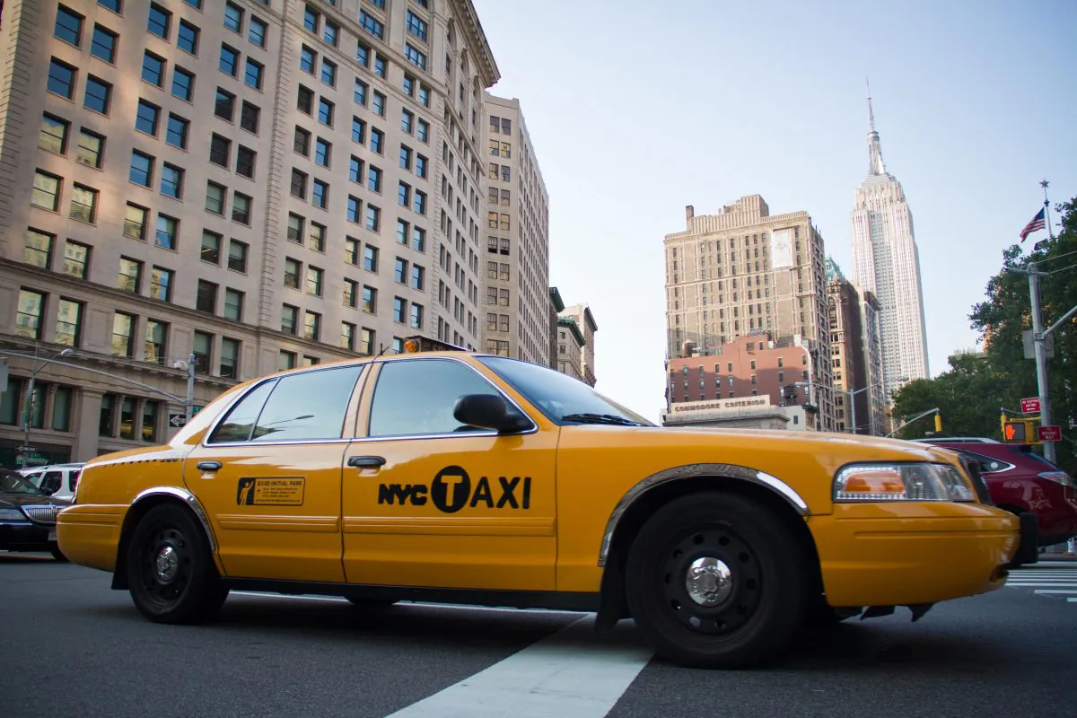A taxi drives across 23rd Street in the Flat Iron District of Manhattan on July 7, 2012. (Benjamin Chasteen/Epoch Times