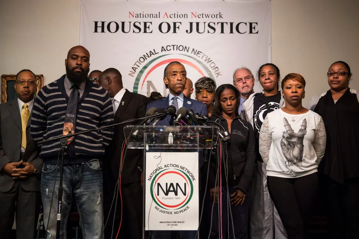 (L-R) Michael Brown Sr., father of Michael Brown Jr.; Benjamin Crump, lawyer for Michael Brown Jr's family; Reverand Al Sharpton; Kimberly Michelle Ballinger, Mother of Akai Kareem Gurley's daughter; Gwen Carr, Mother of Eric Garner; Lesley McSpadden, mother of Michael Brown Jr, and Emerald Garner, daughter of Eric Garner attend a press conference on the eve of Thanksgiving to pray and address the events of the last few days regarding the grand jury verdict of police officer Darren Wilson on Nov. 26, 2014, in New York City. Police officer Darren Wilson shot 18-year-old Michael Brown in Ferguson, Mo., on Aug. 9, sparking large ongoing protests. (Andrew Burton/Getty Images)