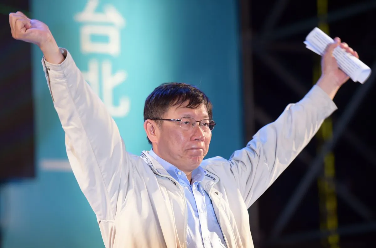 Newly-elected independent Taipei Mayor Ko Wen-je gestures after winning the mayoral election in Taipei on Nov. 29, 2014. Taiwan's warmer relations with China were called into question on Nov. 30 after the island's Beijing-friendly ruling party suffered a massive defeat at local elections. (Sam Yeh/AFP/Getty Images)