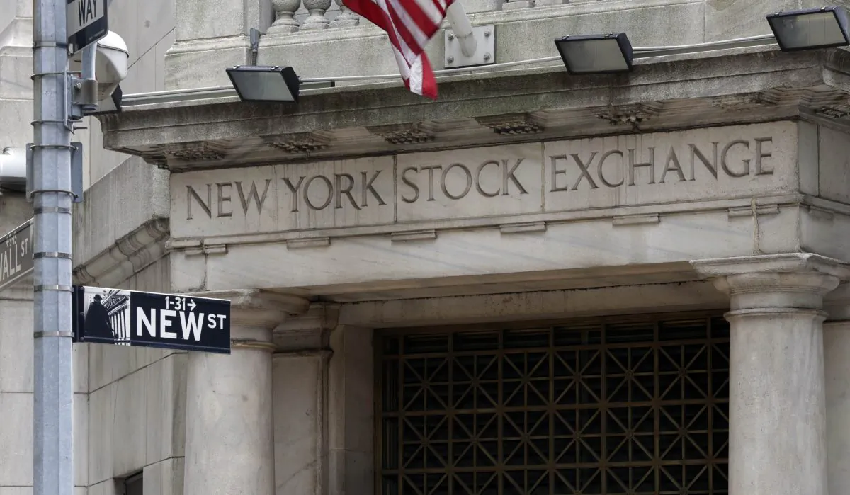 The Wall Street entrance of the New York Stock Exchange, Thursday, Oct. 2, 2014. Global stock markets drifted higher Wednesday Dec. 2, 2014, after Chinese business surveys offered some optimism about the world's No. 2 economy. (AP Photo/Richard Drew)