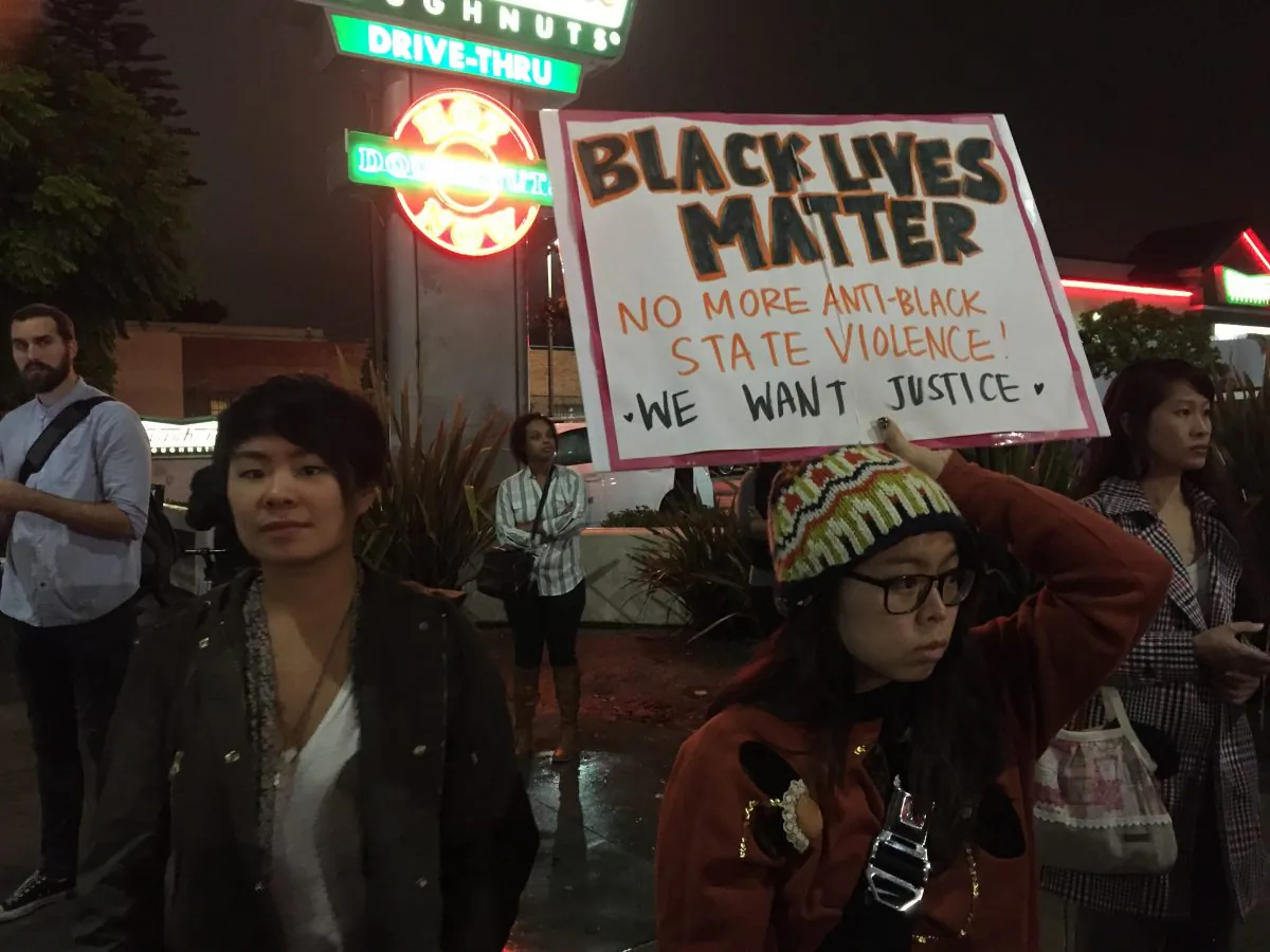 Demonstrators in Leimert Park, a neighborhood in Los Angeles, California on Dec. 3, 2014 after the announcement that white a police officer involved in the death of black New York resident Eric Garner would not be indicted. (Sarah Le/Epoch Times)