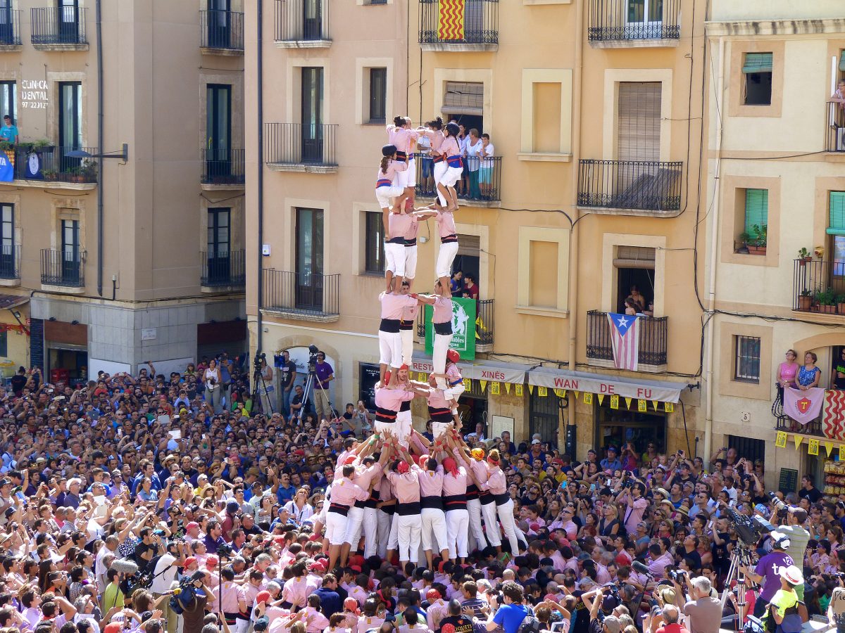 The crowd gathers to watch a human tower form at at the 10-day Santa Tecla Festival in Tarragona, Spain. The towers can reach hundreds of feet high and involve several hundred individuals. (Manos Angelakis)