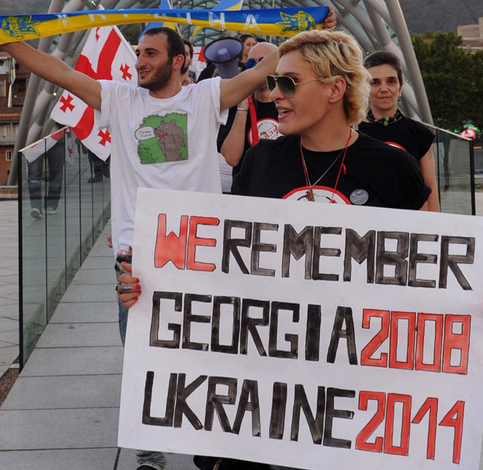 Protesters hold posters and shout slogans during a rally in support of Ukraine and against the Russian President Vladimir Putin, in Tbilisi, on Aug. 26, 2014. (Vano Shlamov/AFP/Getty Images)
