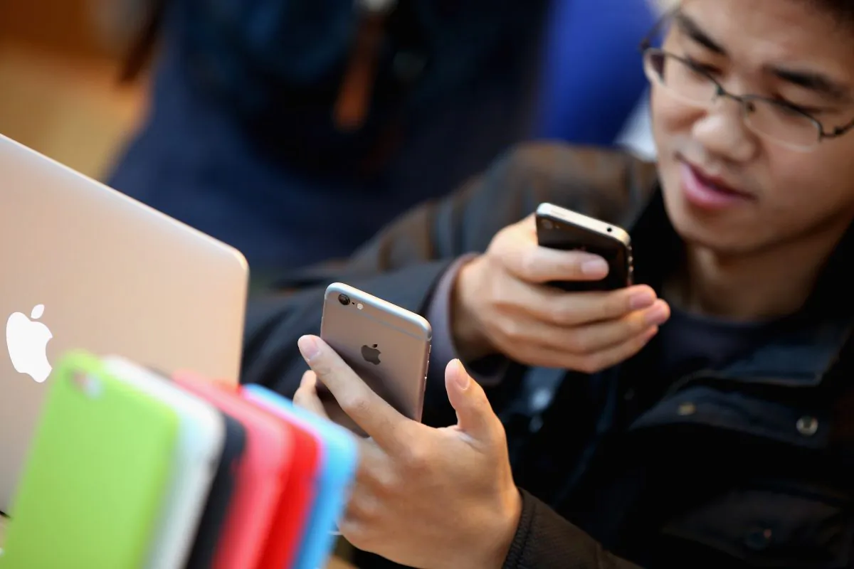 A man sets up his new iPhone 6 inside an Apple store on Oct. 17, 2014 in Beijing, China. A Chinese firm claims Apple violated its patent for the design of the iPhone 6. (Feng Li/Getty Images)