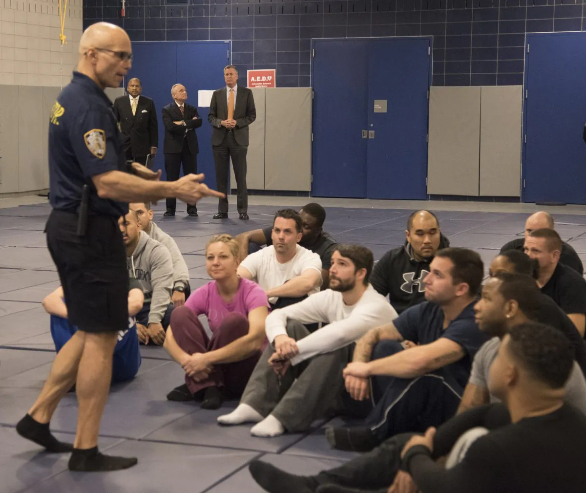 New York Mayor Bill de Blasio (R) and police Commissioner William Bratton (C) at the new New York City Police Academy in the Queens borough of New York on Thursday, Dec. 4, 2014. De Blasio and Bratton Thursday outlined training that all officers would receive on tactical skills and communication. (AP Photo/The Daily News, Richard Harbus)