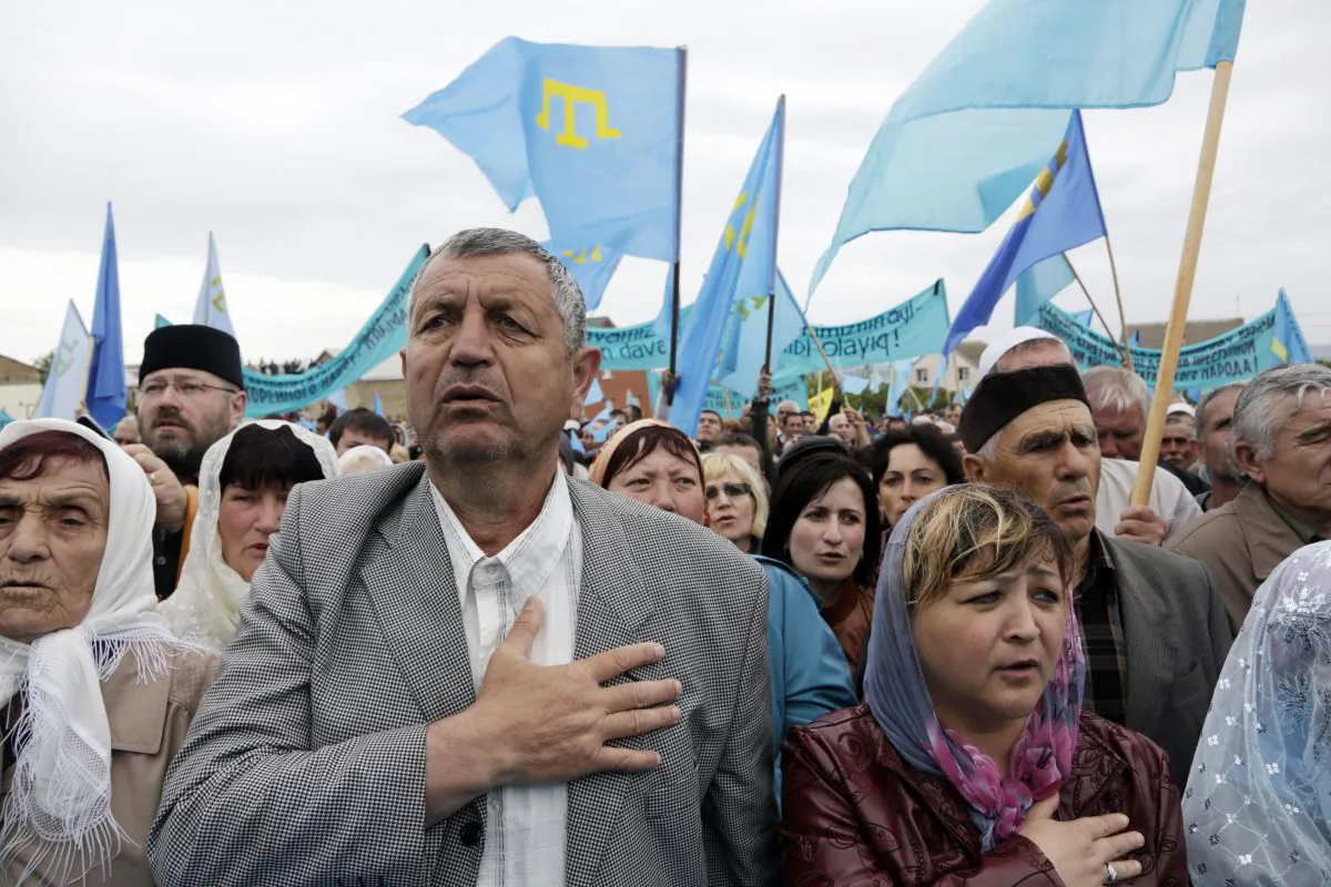 Crimean Tatars attend a memorial ceremony marking the 70th anniversary of the deportation of Tatars from Crimea, near a Mosque in Simferopol, on May 18, 2014. (Max Vetrov/AFP/Getty Images)