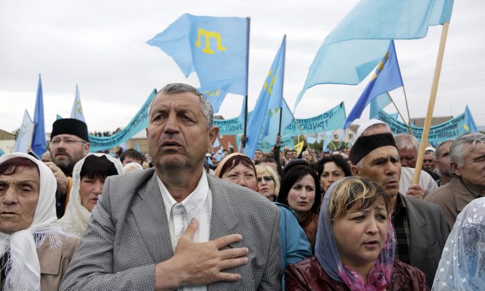Crimean Tatars attend a memorial ceremony marking the 70th anniversary of the deportation of Tatars from Crimea, near a Mosque in Simferopol, on May 18, 2014. (Max Vetrov/AFP/Getty Images)