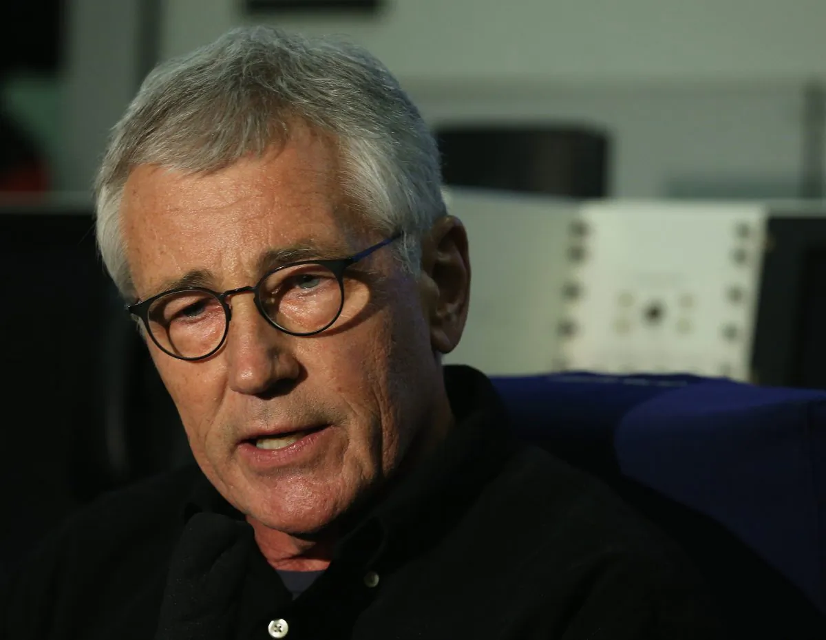 US Secretary of Defense Chuck Hagel speaks to the media about his trip to Afghanistan while aboard his aircraft on Dec. 5, 2014. (Mark Wilson/AFP/Getty Images)