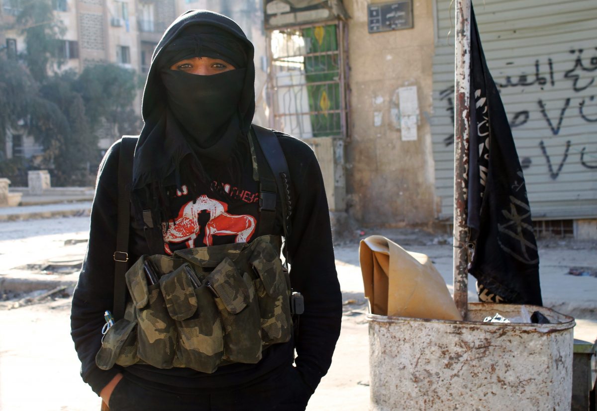 A jihadist member of al-Qaeda-linked group Nusra Front stands in a street of the northern Syrian city of Aleppo on Jan. 11, 2014. (Baraa Al-Halabi/AFP/Getty Images)