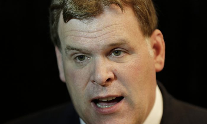 Canadian Minister of Foreign Affairs John Baird speaks to The Associated Press at the 10th International Institute for the Strategic Studies in Manama, Bahrain, Saturday, Dec. 6, 2014. (AP Photo/Hasan Jamali)