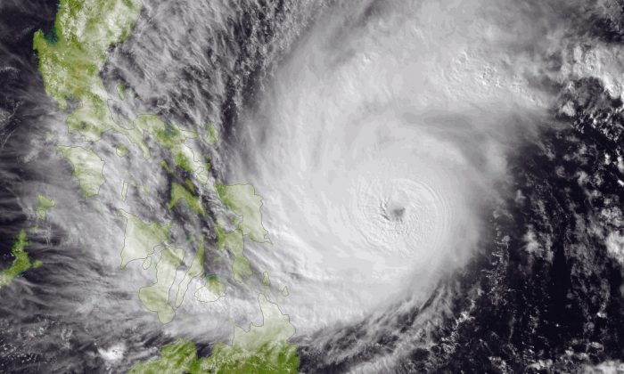 This image made available by the National Oceanic and Atmospheric Administration (NOAA) shows Typhoon Hagupit on Friday, Dec. 5, 2014, as it approaches the Philippines. The ferocious and dangerously erratic typhoon is blowing closer to the Philippines as differing forecasts about its path prompt a wide swath of the country to prepare for a weekend of destructive winds and rain. (AP Photo/NOAA)